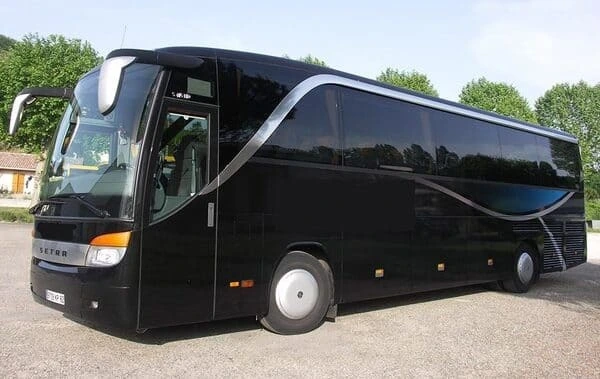 Sleek 44-seater luxury coach available for hire in Paris, featuring a black exterior